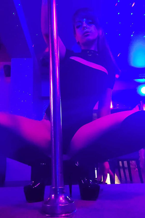 Dynamic strip club scene featuring dancer