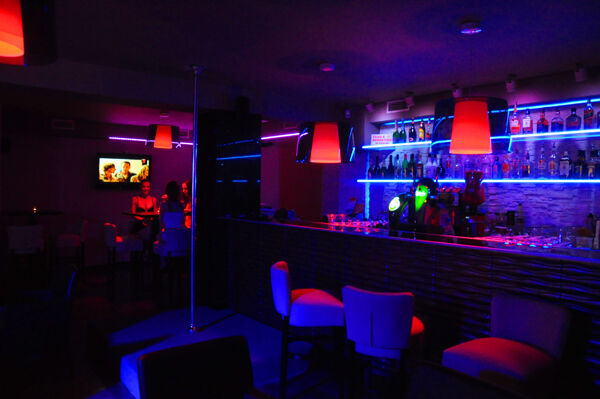Stripper pole and bar counter with soothing lights