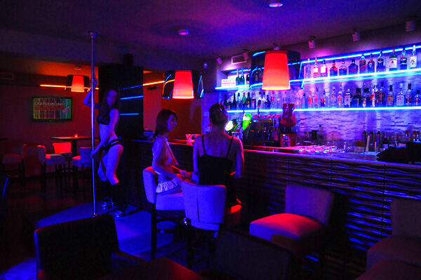 The most important parts of the club; the striptease dance pole and the bar counter